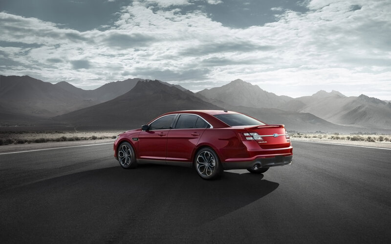 Red Sedan on Road — Dramatic