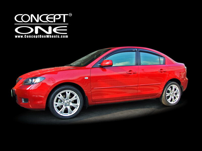 Red sedan with custom wheels