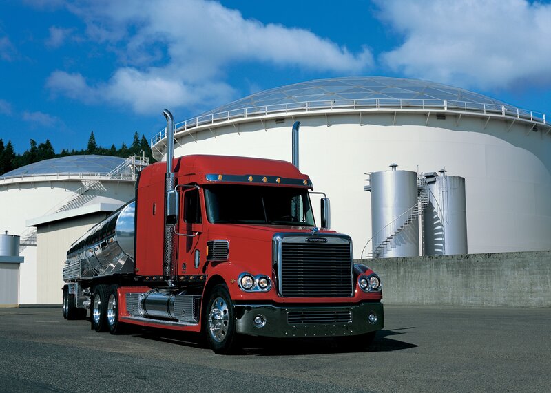 Red semi-truck at fuel facility