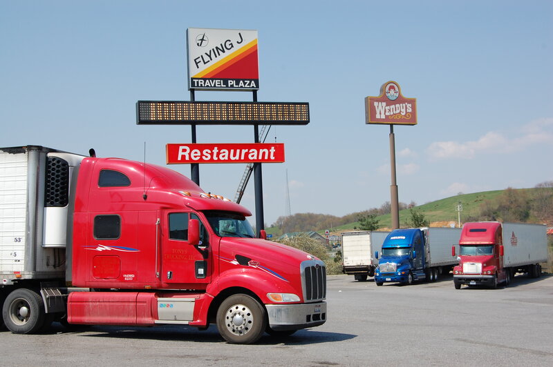 Red Semi-truck at Rest Stop