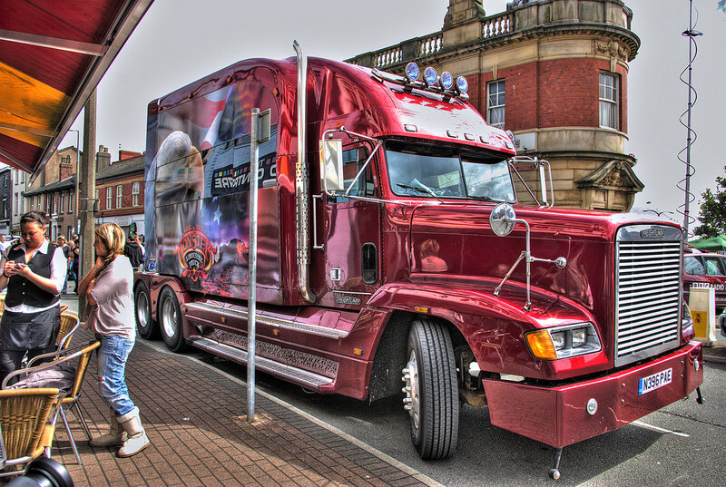 Red semi-truck on city street