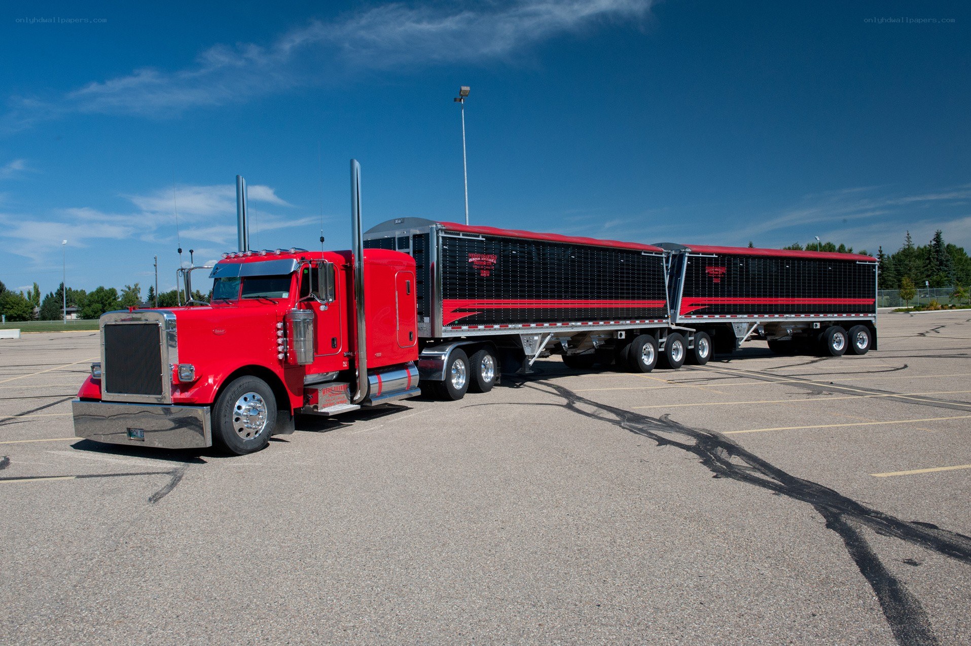Red semi-truck with trailers