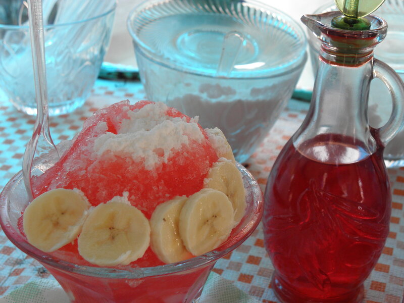 Red shaved ice with bananas