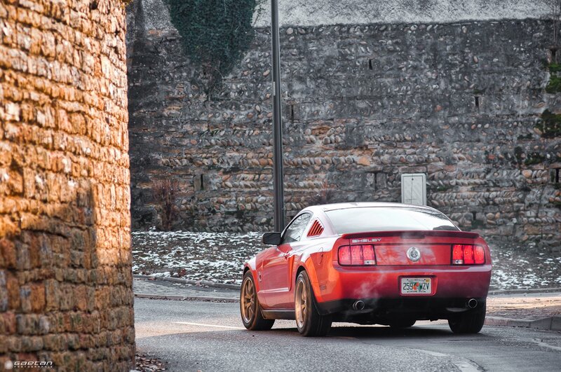 Red Shelby Mustang on a street