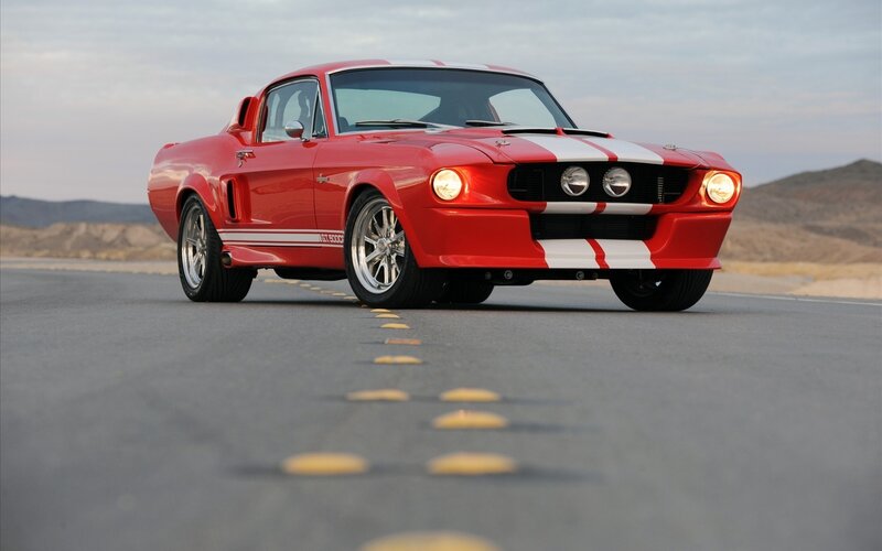 Red Shelby Mustang on desert road
