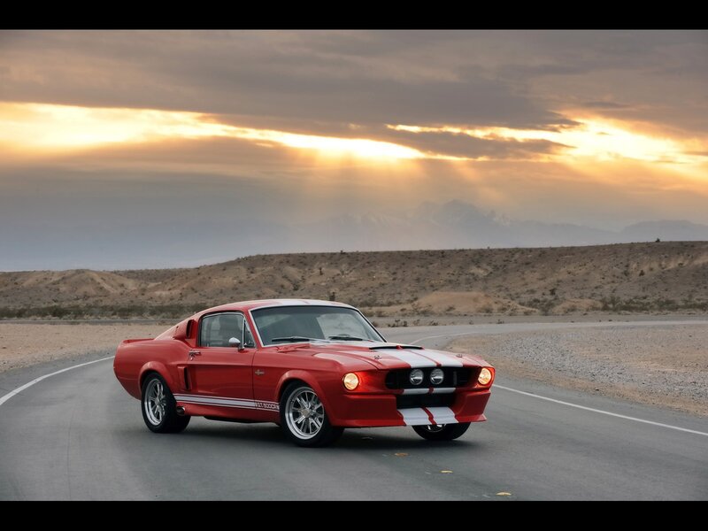 Red Shelby Mustang on desert road