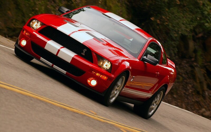 Red Shelby Mustang on road