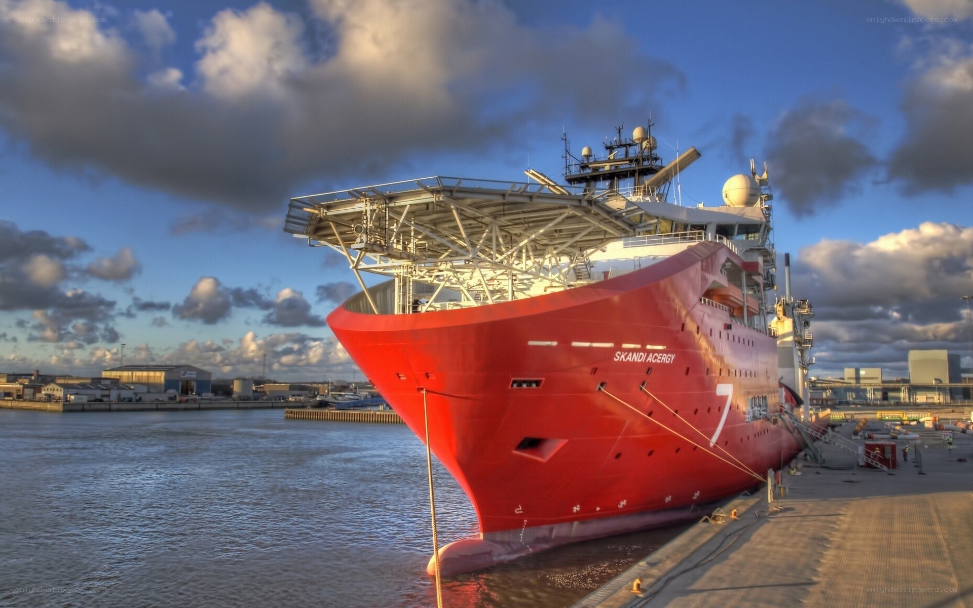 Red ship docked at port