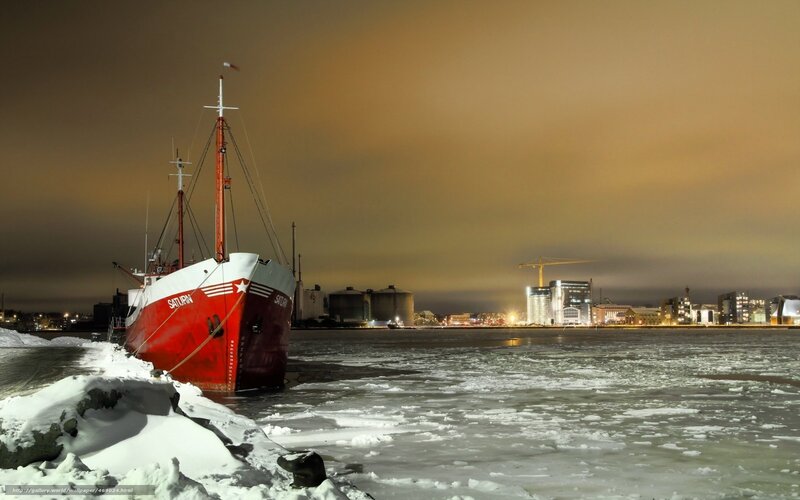 Red ship in icy harbor