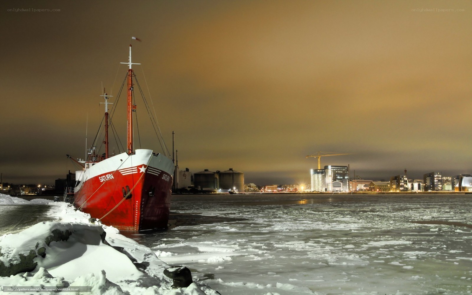 Red ship in icy harbor