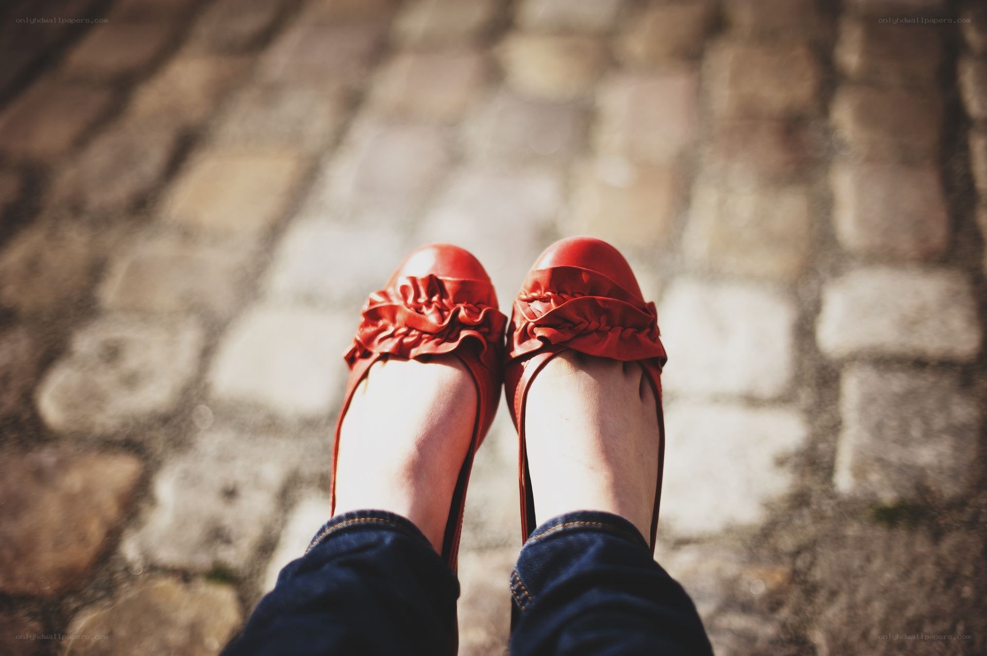 red shoes on cobblestones