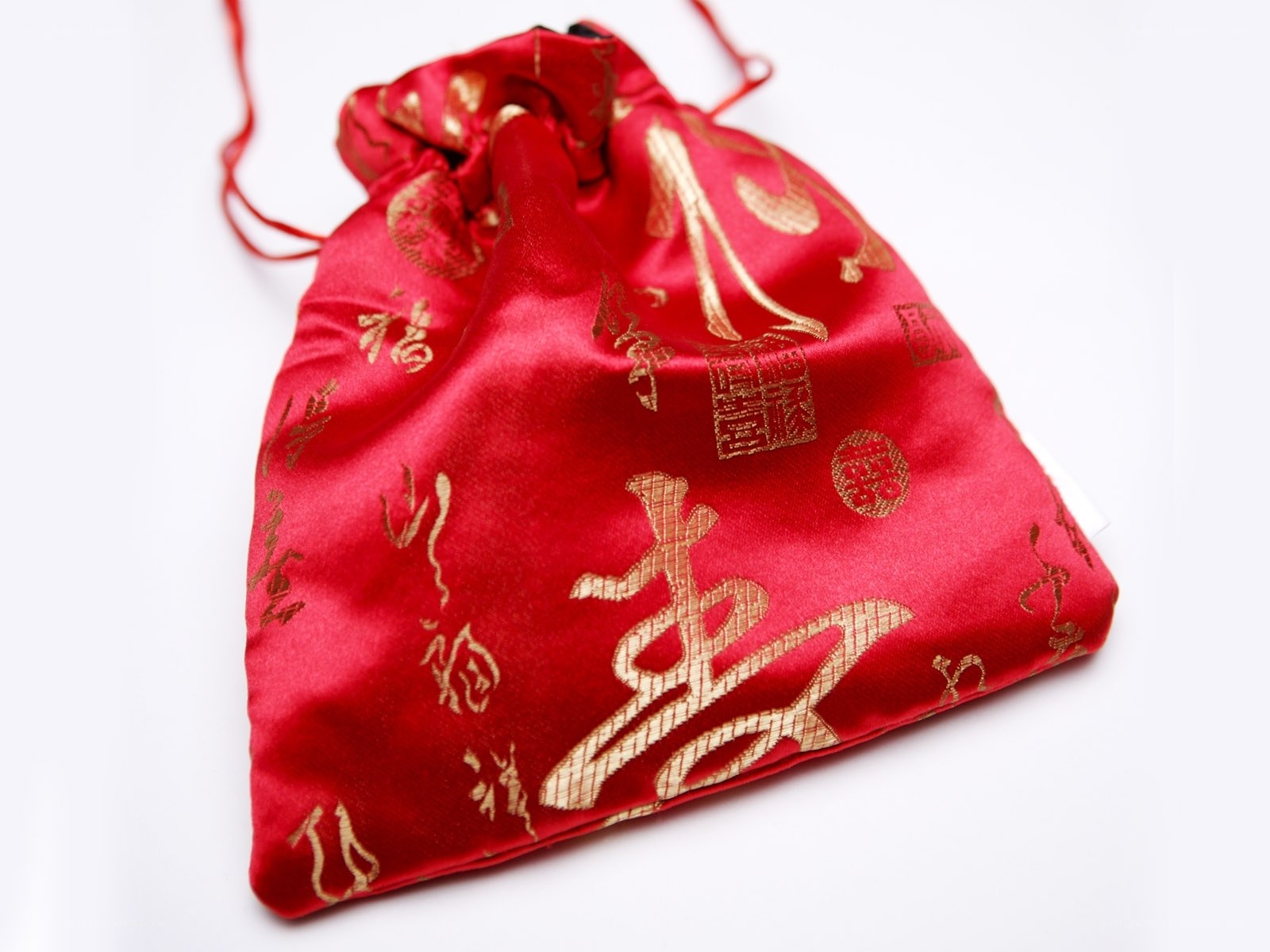 red silk pouch with gold characters