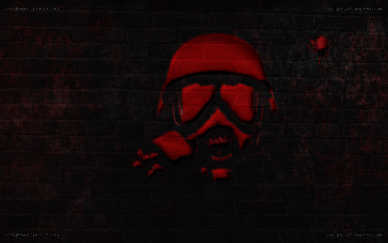 red skull graffiti on brick wall