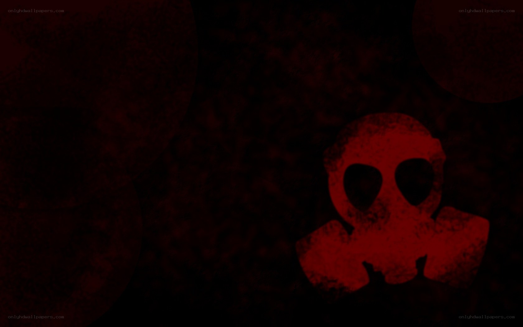 red skull symbol on dark background
