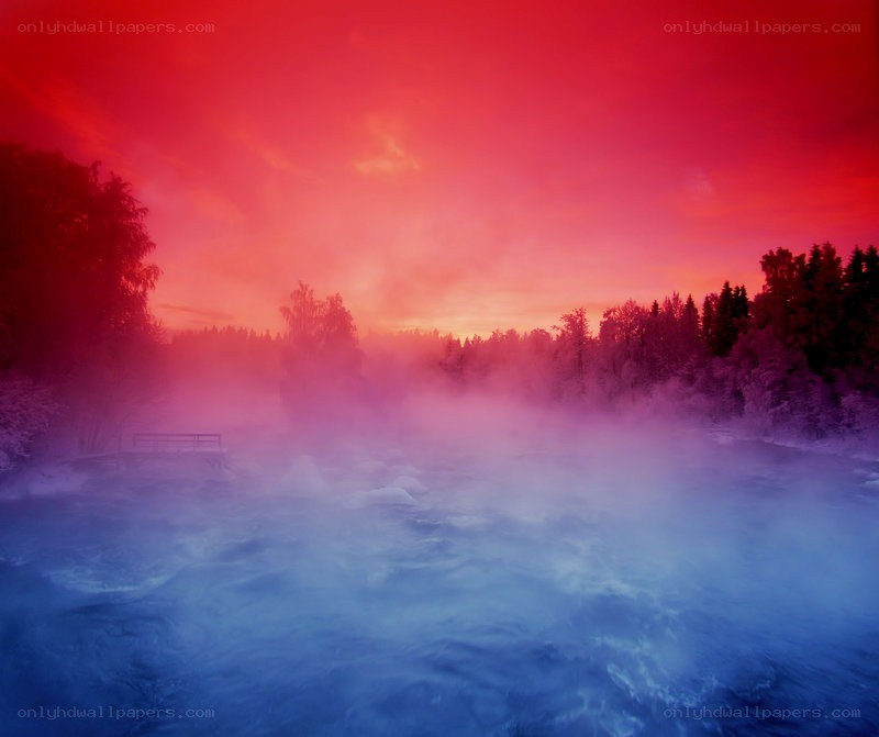 Red sky over a misty river
