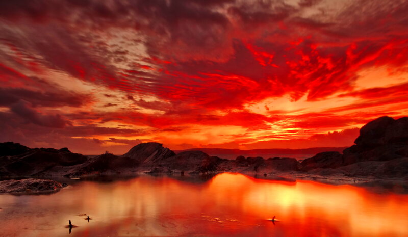 Red Sky over Rocky Shore