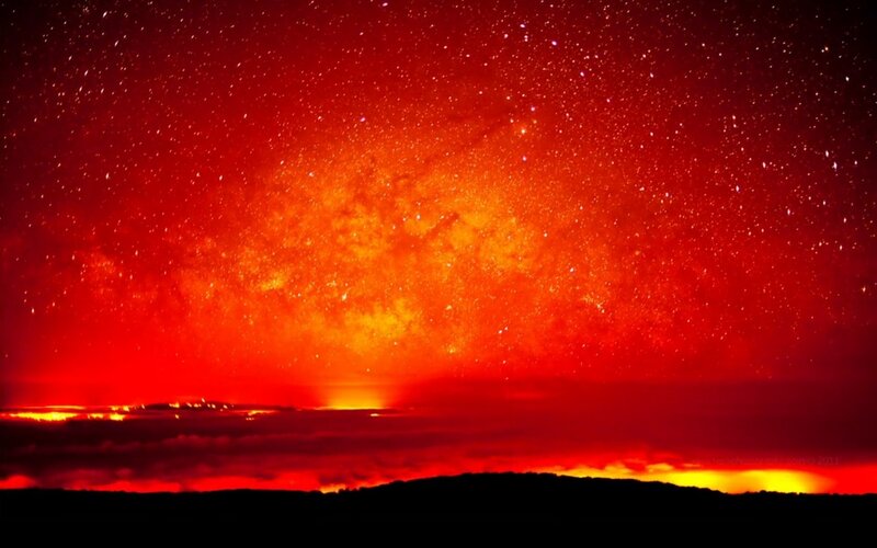 Red sky over volcanic landscape