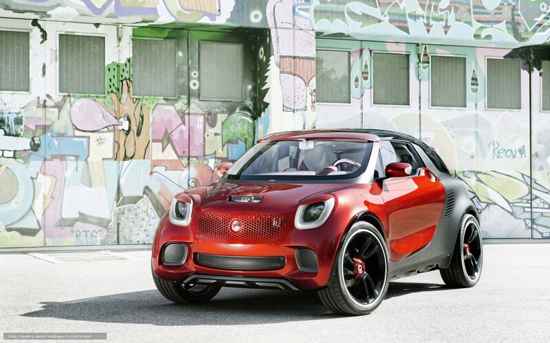 Red smart car in graffiti alley