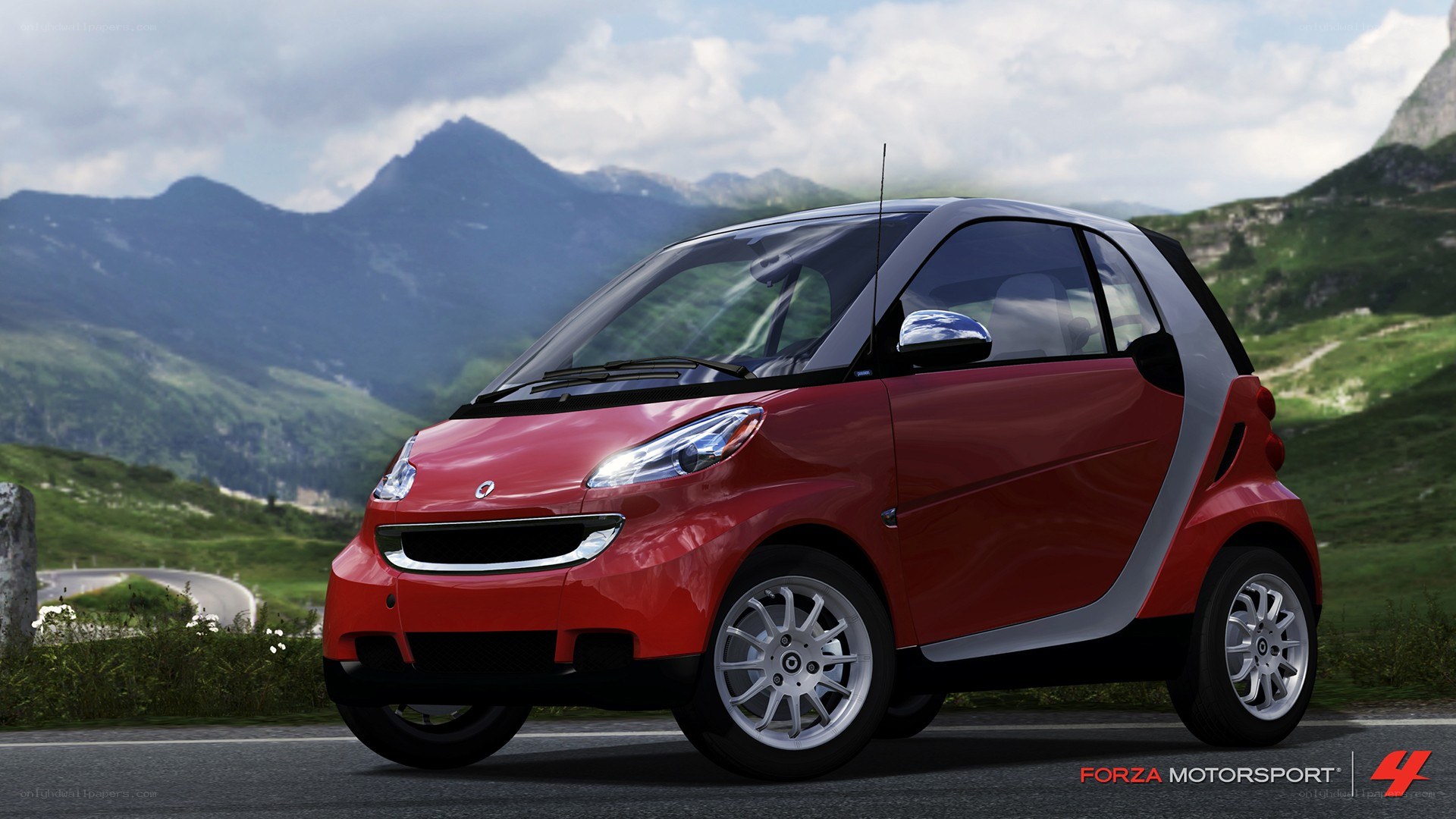 Red smart car on mountain road