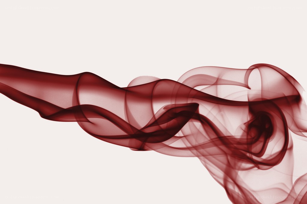 Red smoke swirls