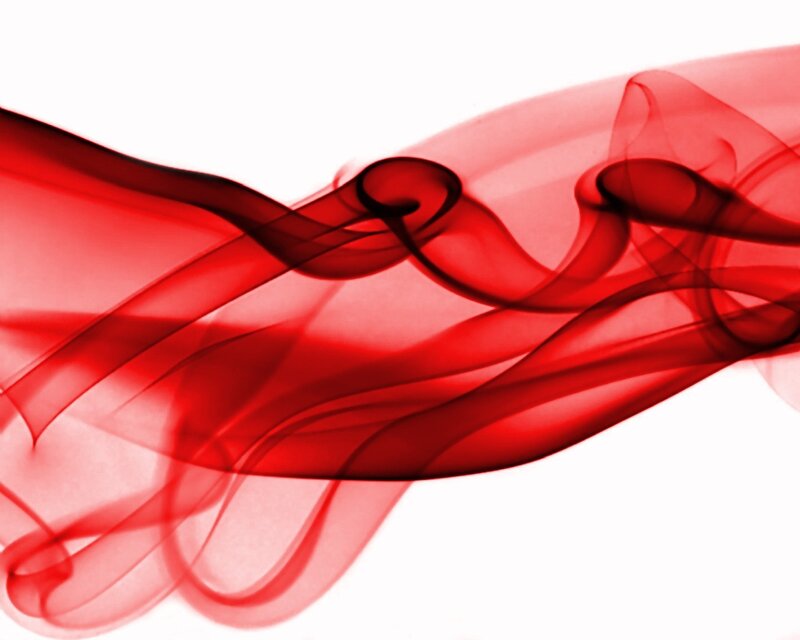 Red smoke swirls