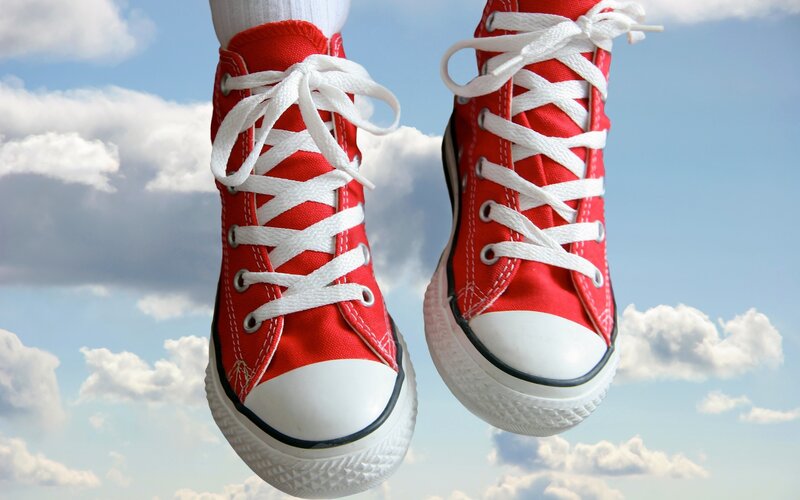 red sneakers against sky