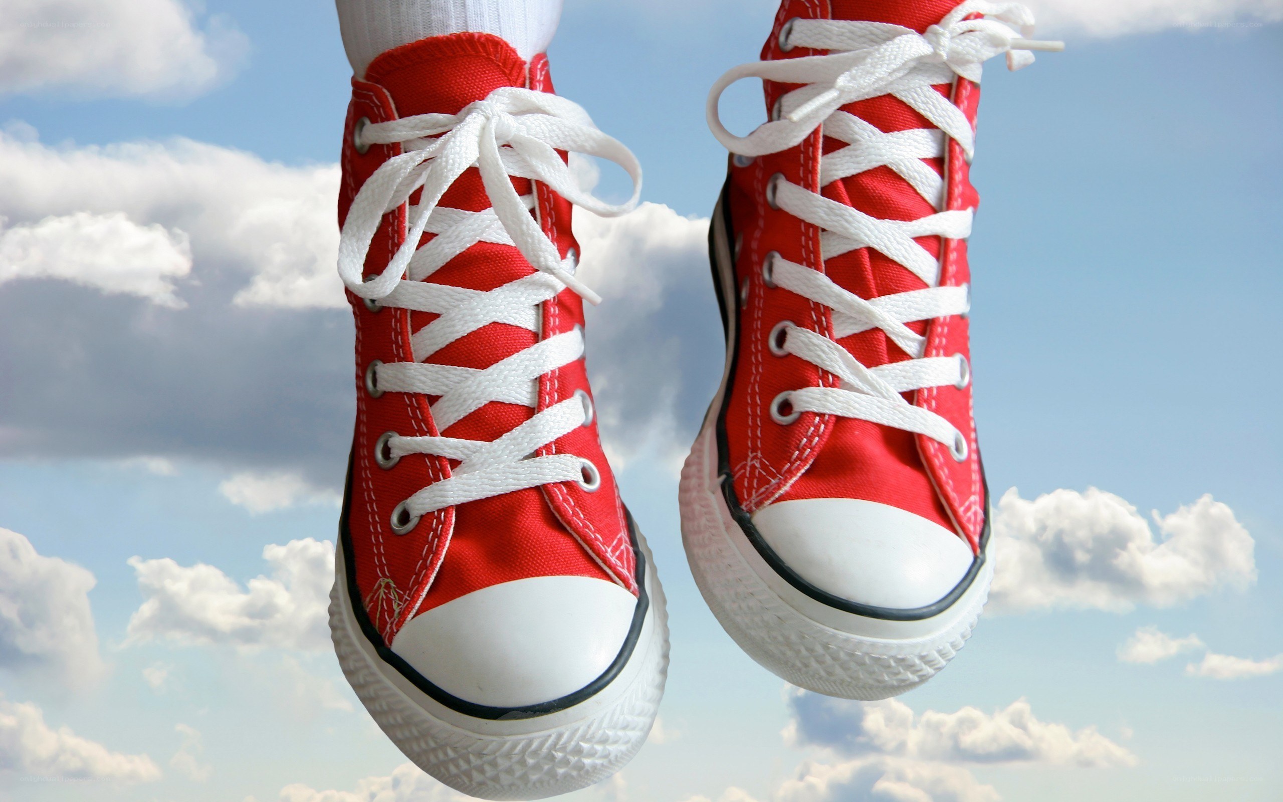 red sneakers against sky