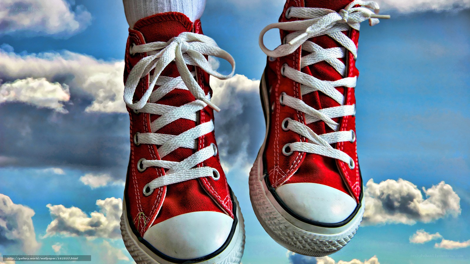 Red sneakers against sky