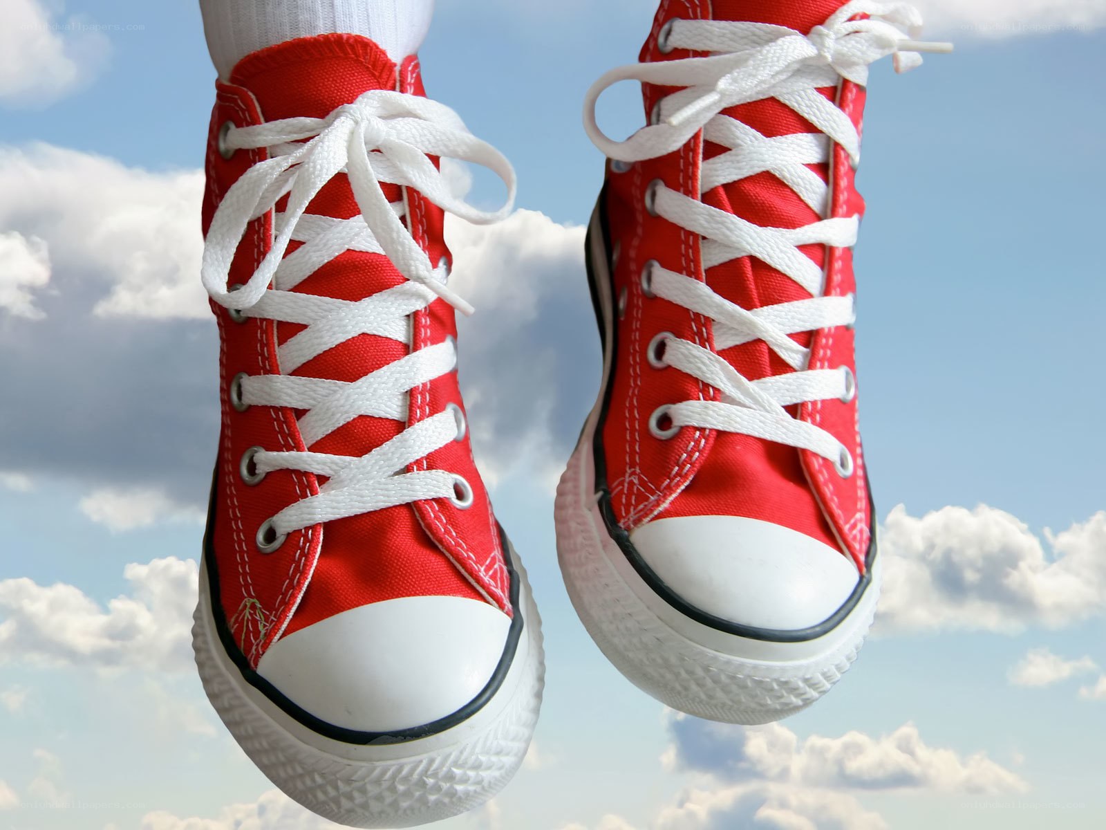 red sneakers in the sky