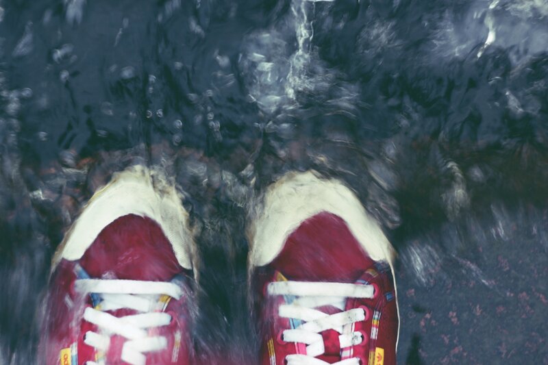 red sneakers in water