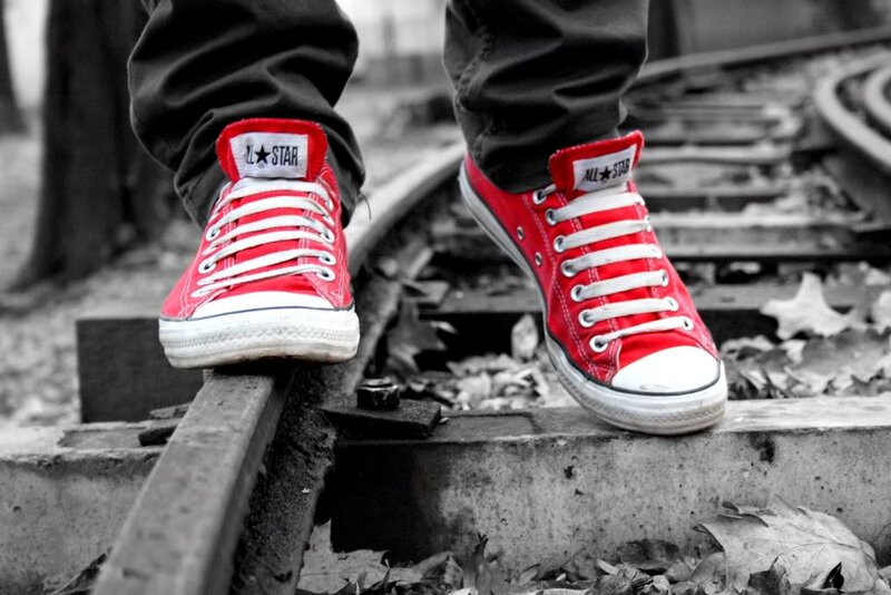 Red Sneakers on Train Tracks