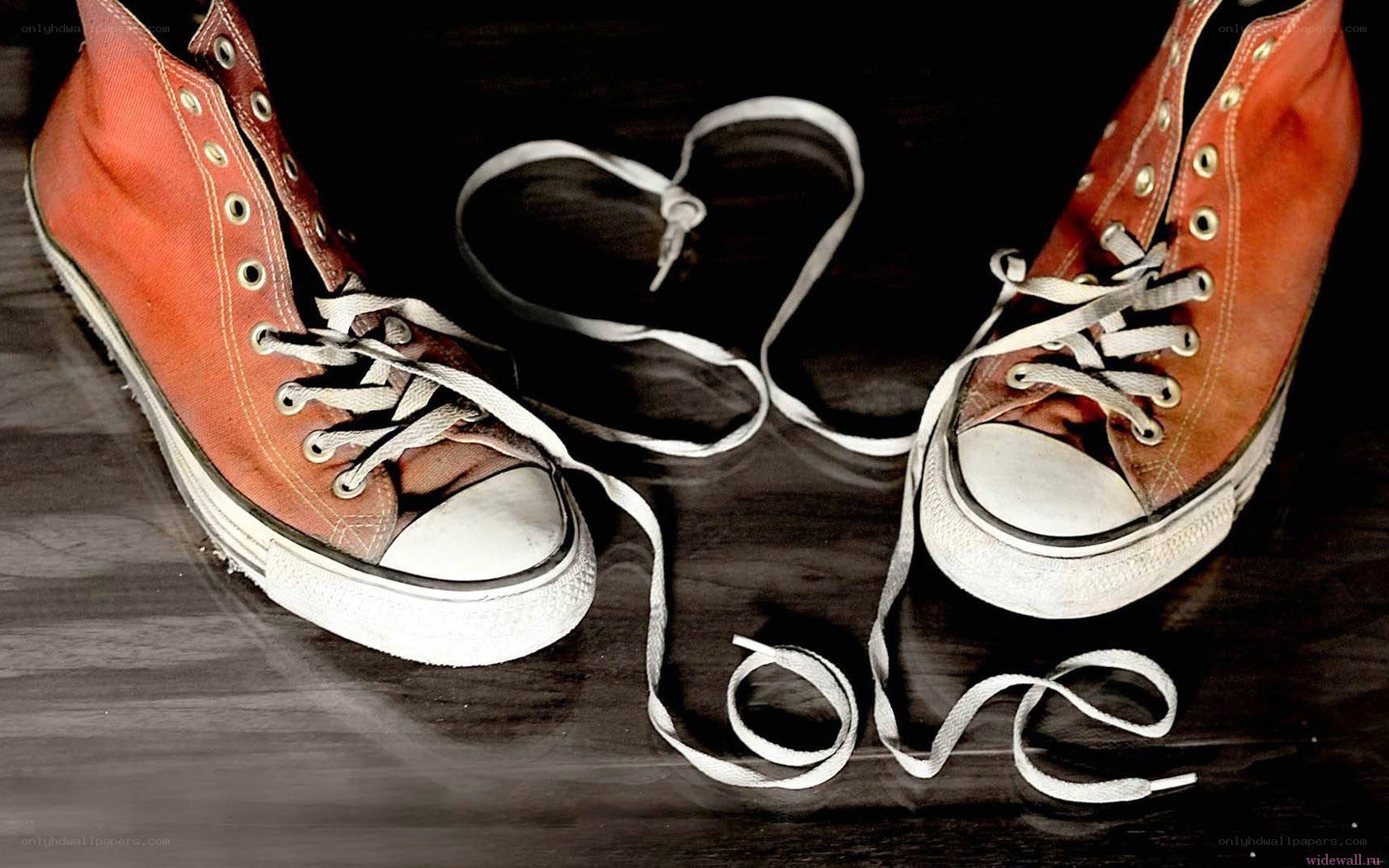 Red sneakers with heart-shaped laces