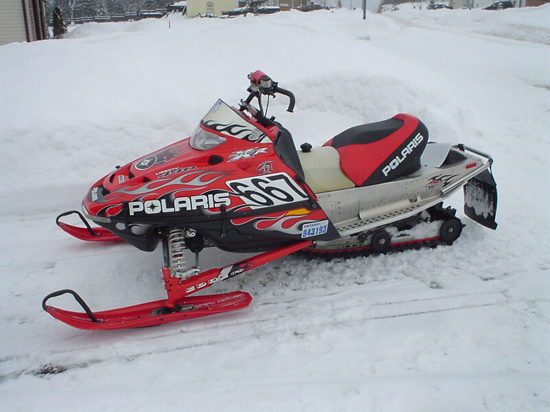 Red Snowmobile in Snow — Cold