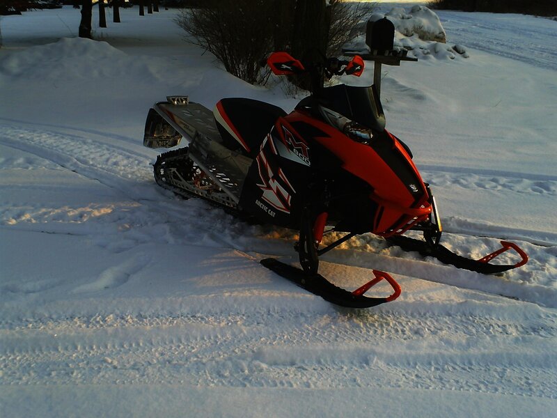 Red Snowmobile in Snow