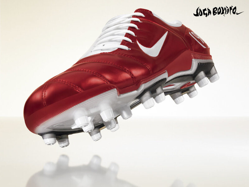 red soccer cleat with white laces
