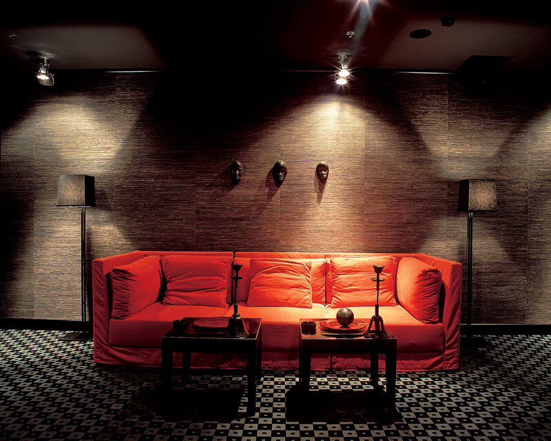 Red sofa in dimly lit room