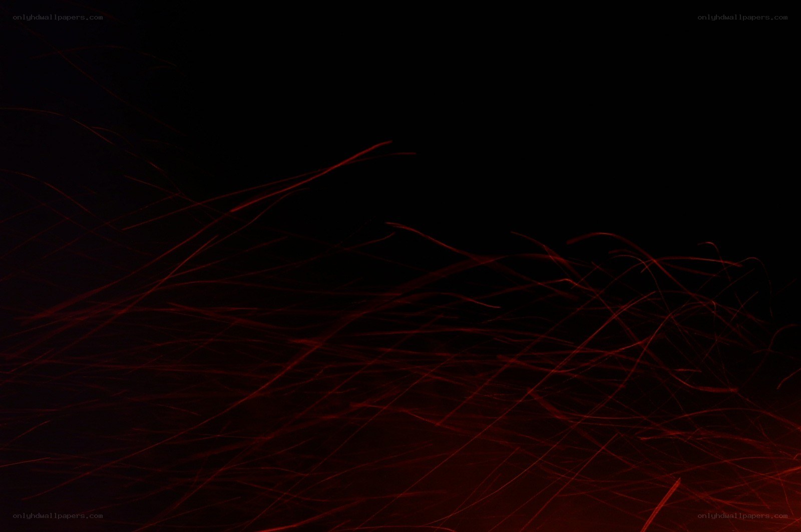 Red sparks against black background