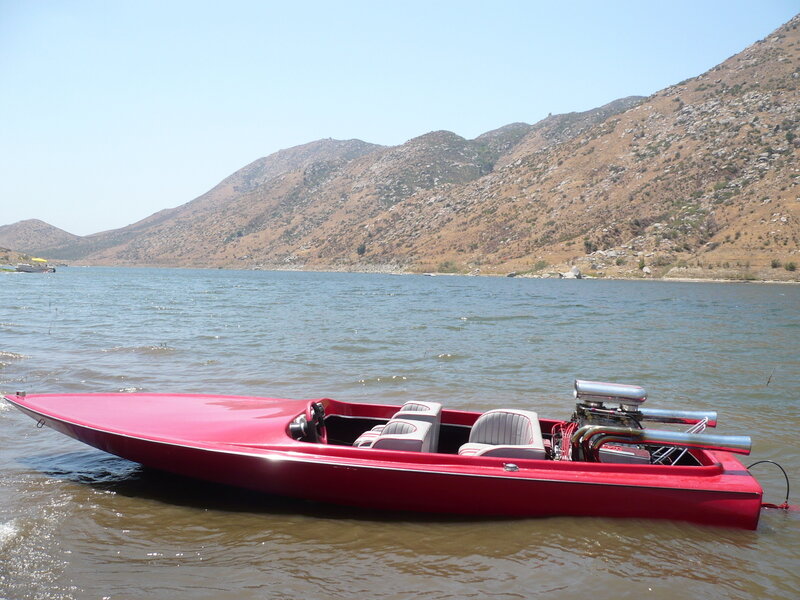 Red Speedboat on Lake