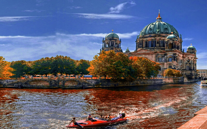 Red Speedboat on River