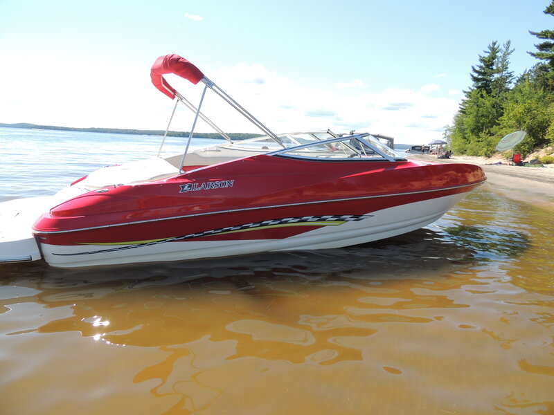 Red Speedboat on Shore