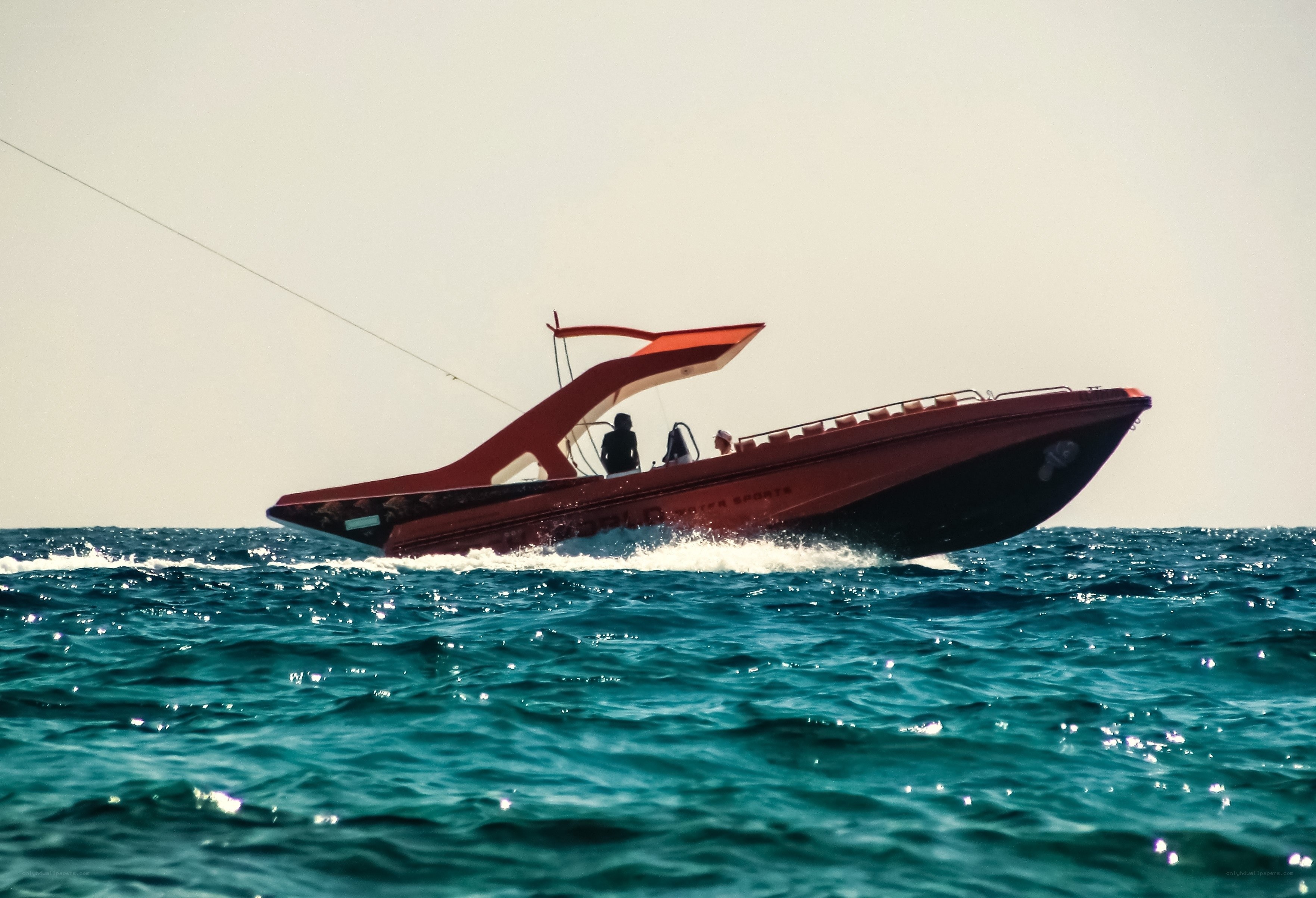Red speedboat on the open sea