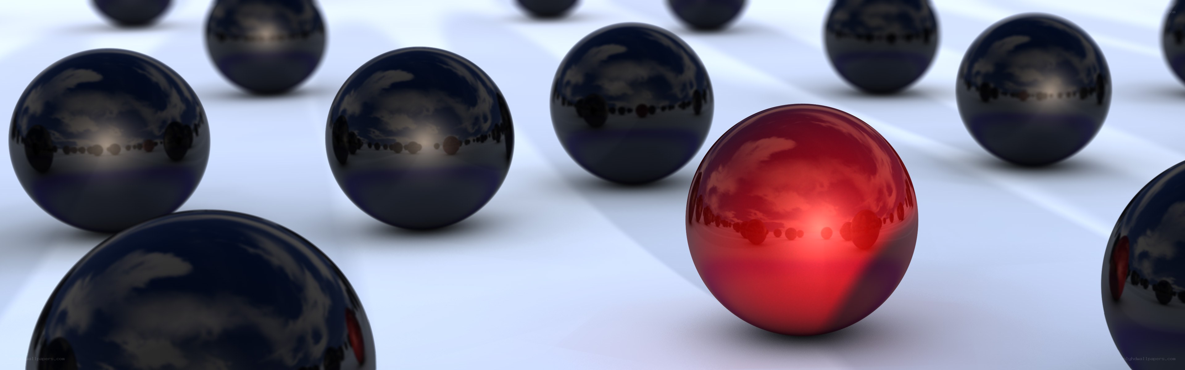 Red sphere among black spheres