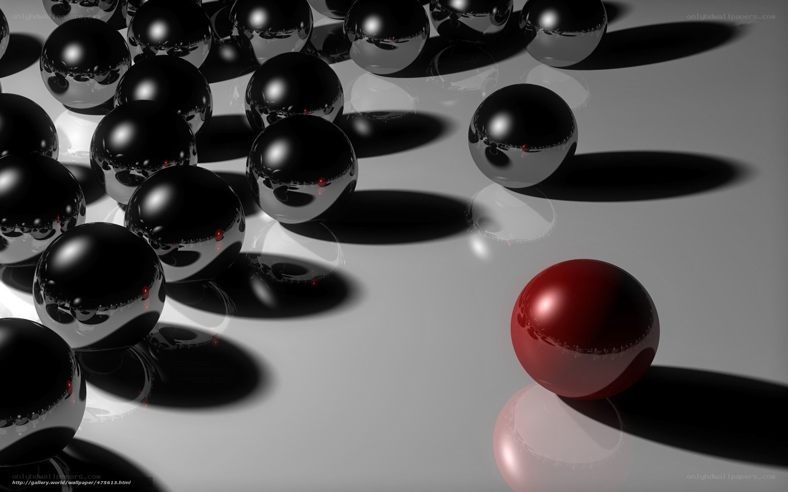 Red sphere among black spheres