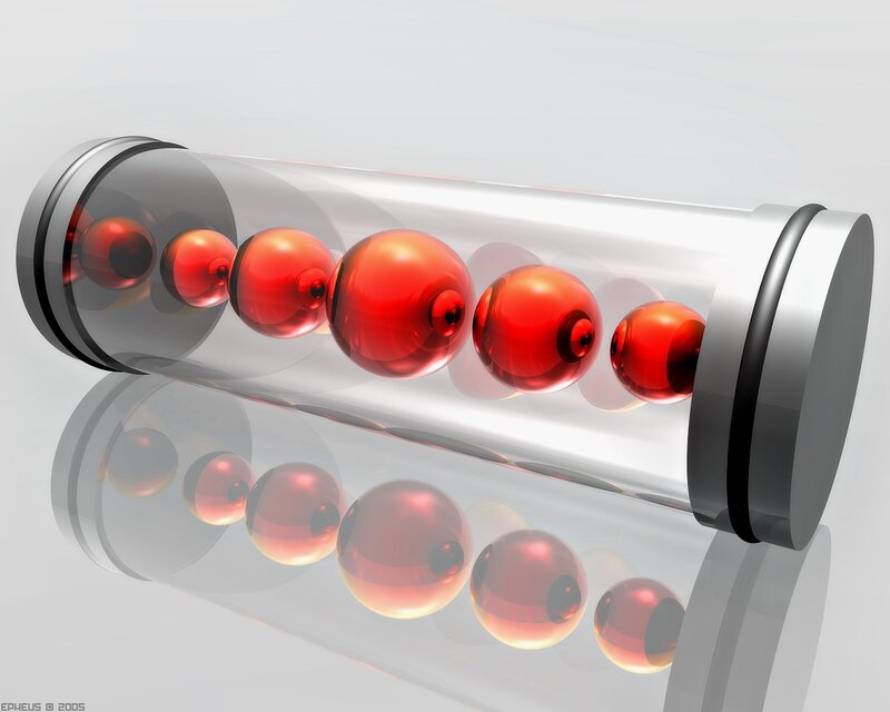 Red spheres in a glass tube