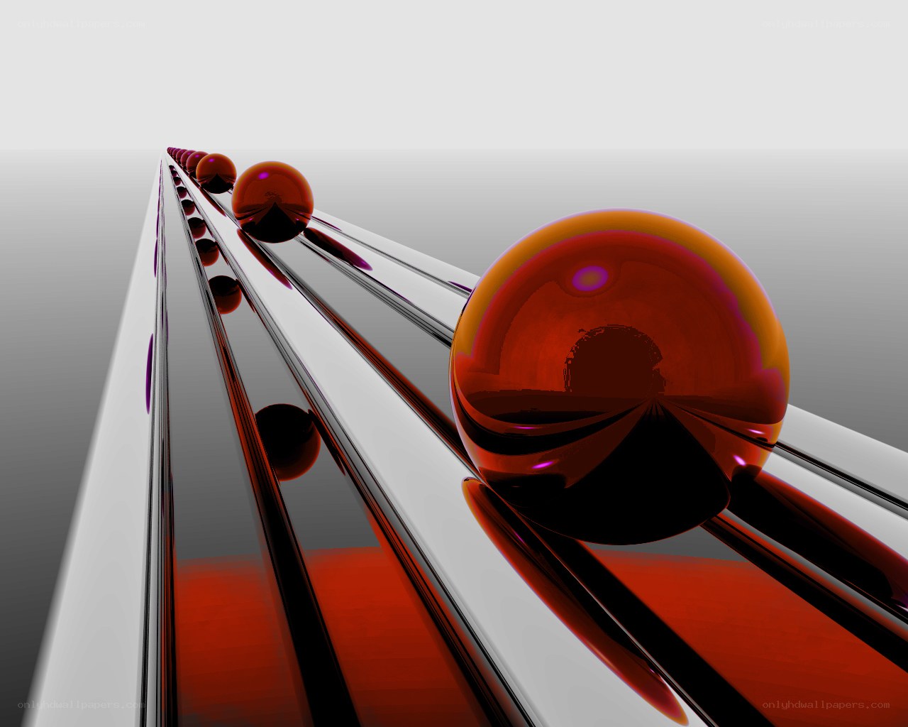 Red spheres on a metallic track