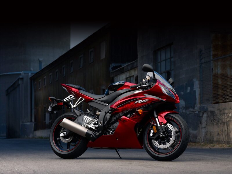 Red sport motorcycle in alley