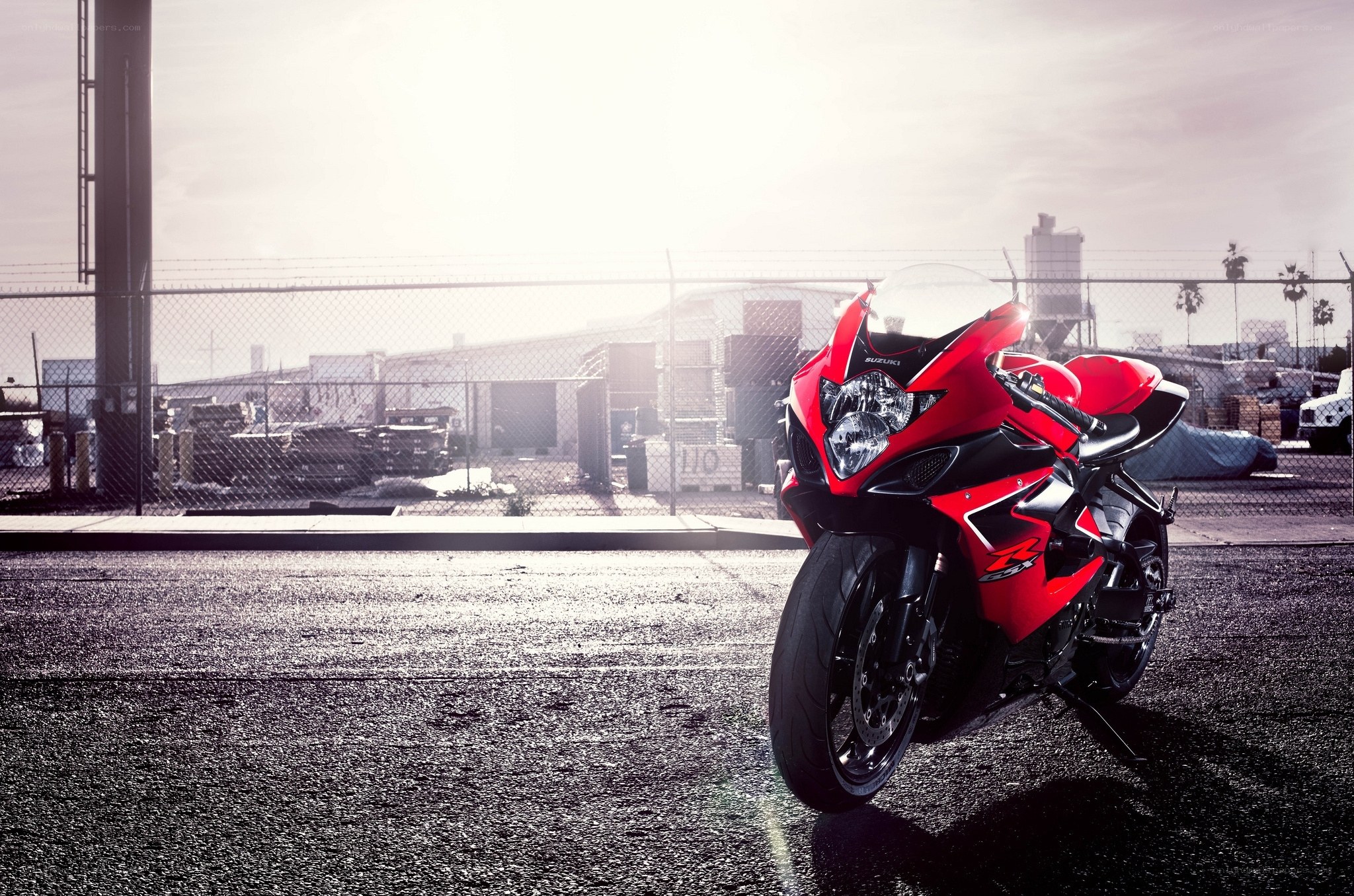Red sport motorcycle in industrial lot