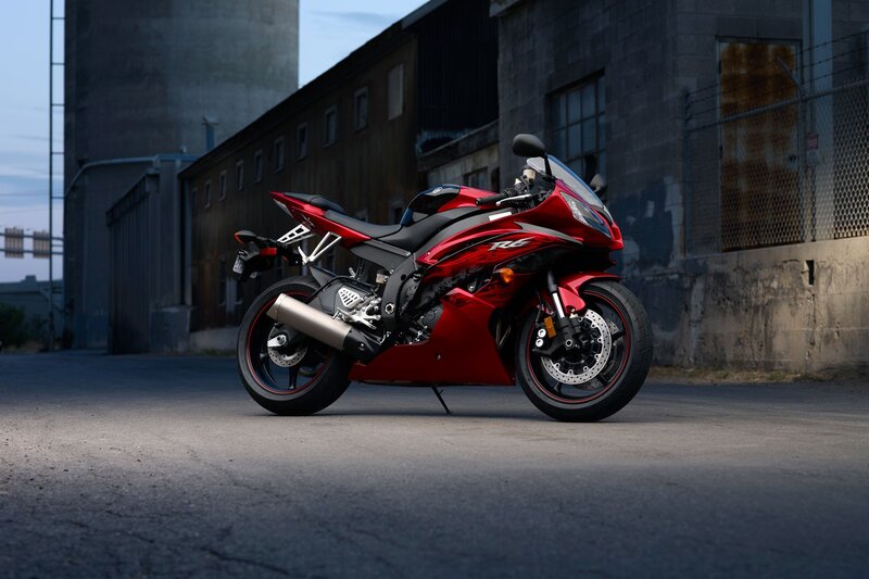 Red sport motorcycle in industrial setting