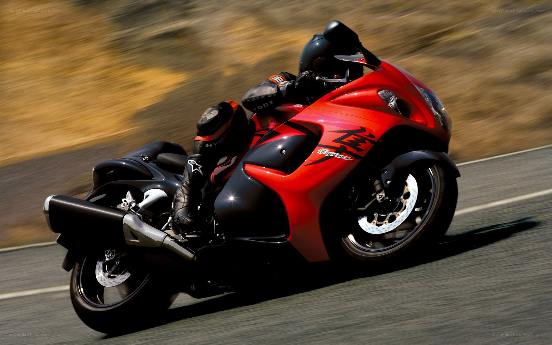 red sport motorcycle in motion