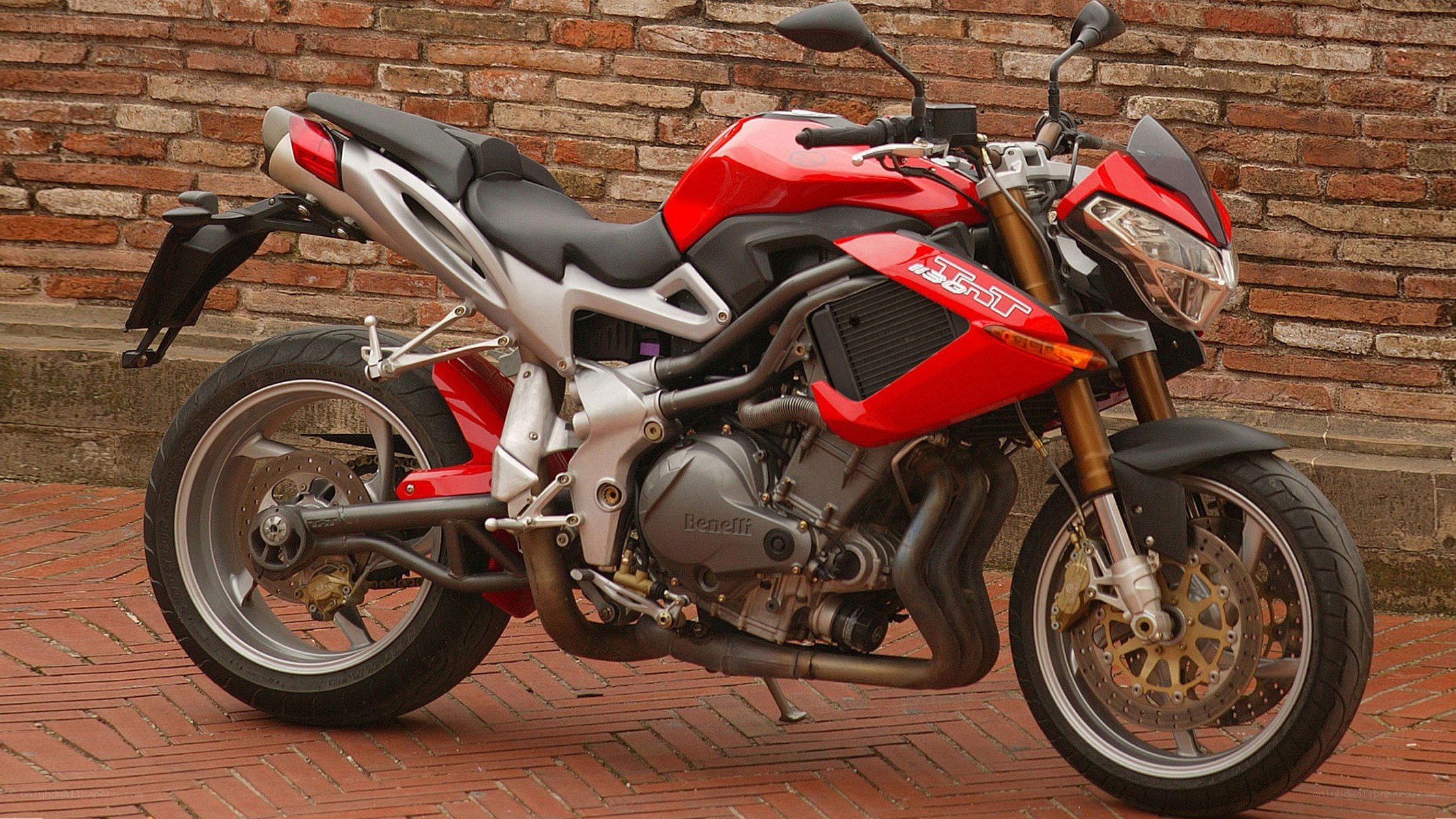 red sport motorcycle on brick